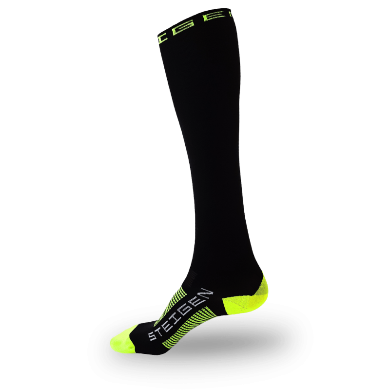 A black knee-high performance sock with a neon yellow toe, heel, and top cuff. The brand name "STEIGEN" is printed in white on the foot, accompanied by neon yellow compression-style stripes across the arch.