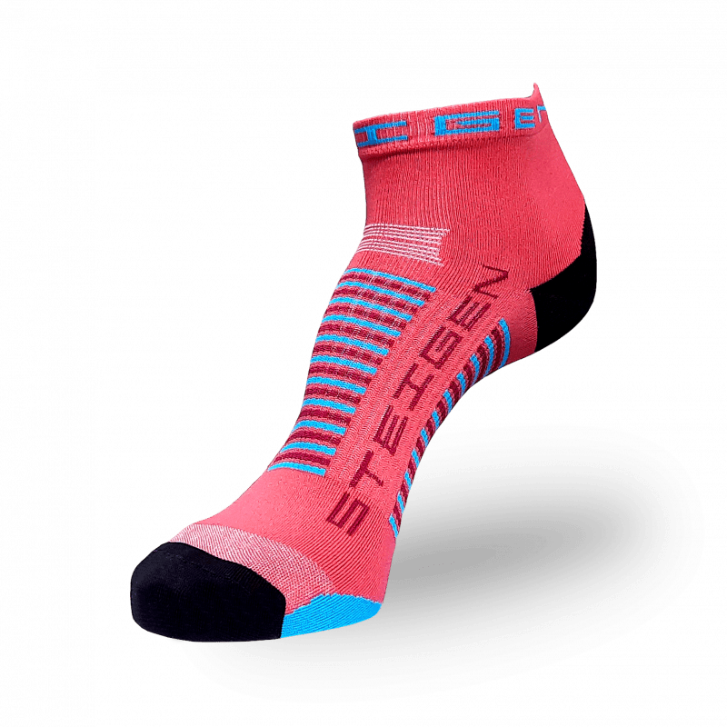 A coral-pink athletic sock with a black heel and light blue toe. It features light blue and navy horizontal stripes wrapping around the arch.