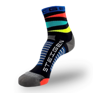 A black Steigen athletic sock with vibrant orange, teal, and yellow horizontal stripes around the ankle. It features a blue cuff, grey toe/heel sections, and white/blue stripes around the arch.