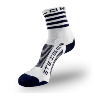 A white Steigen athletic sock with a navy blue toe and heel. The cuff features thick navy blue horizontal stripes. The word "STEIGEN" is printed vertically in navy on the top of the foot with navy and white stripes across the arch.